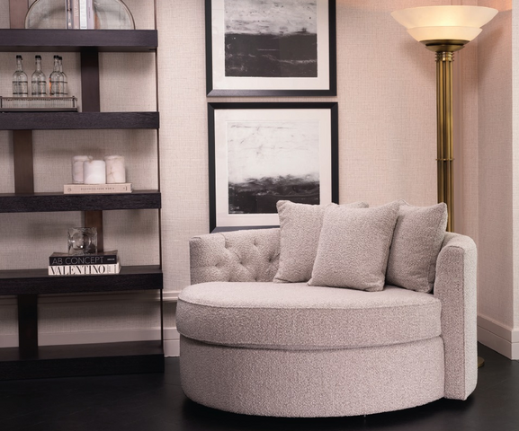 large grey luxury armchair in a living room near a standing light