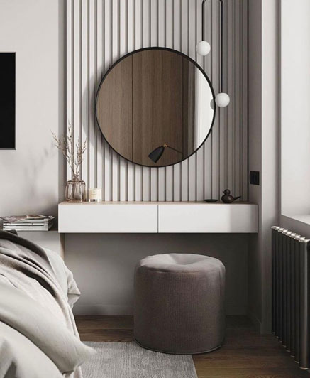 Black round mirror in a luxury bedroom.