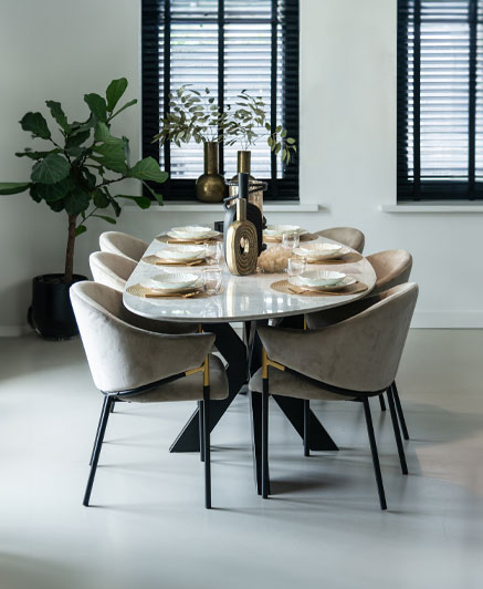 marble top dining table with black base.